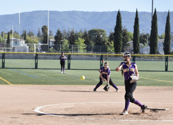 Sophomore Luciana Gonzalez throws an underhand ball toward the batter. Photo | Arshiya Sen
